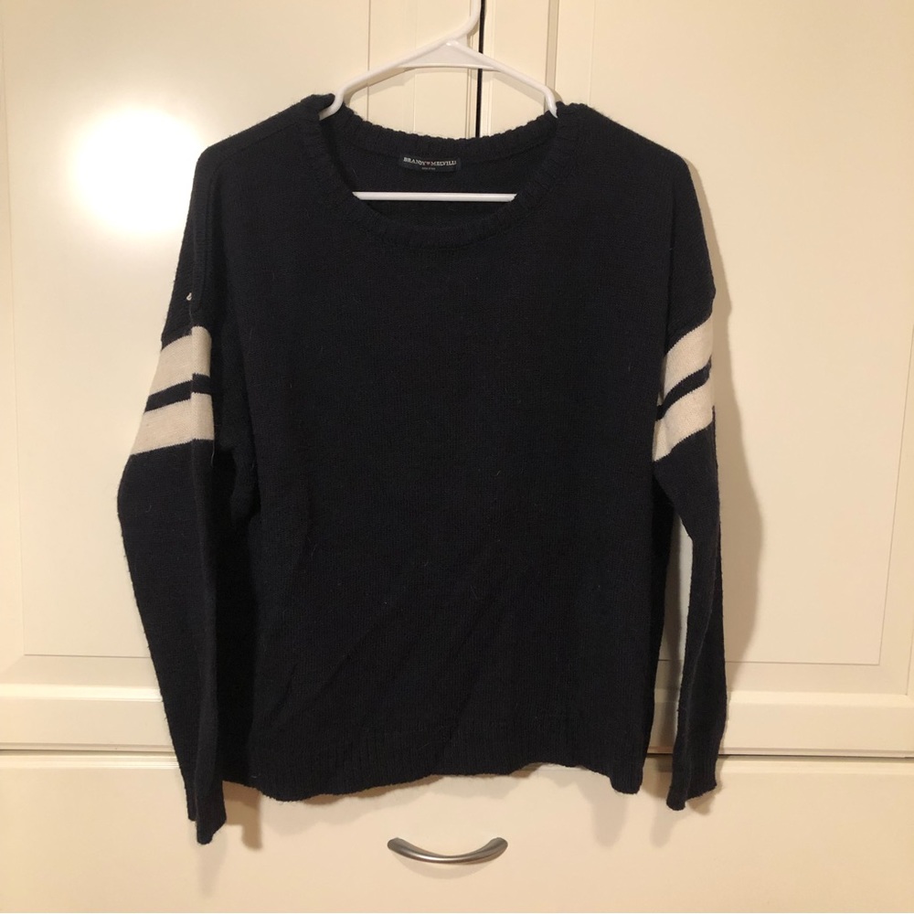 Black Brandy Melville wool sweater with white stripes.